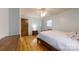 Inviting bedroom with hardwood floors, a ceiling fan, and natural light, offering a comfortable retreat at 2360 Kings Grant Rd, Lincolnton, NC 28092