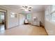 Bedroom featuring hardwood floors, a chair, a closet, and multiple windows offering natural light at 2360 Kings Grant Rd, Lincolnton, NC 28092