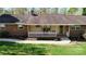 Charming brick home with a covered front porch and well-manicured lawn at 2360 Kings Grant Rd, Lincolnton, NC 28092