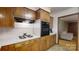 Functional kitchen featuring wooden cabinets, updated appliances, and plenty of space for cooking at 2360 Kings Grant Rd, Lincolnton, NC 28092