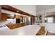 Spacious kitchen features a breakfast bar, wood cabinetry, modern appliances, and great lighting at 2360 Kings Grant Rd, Lincolnton, NC 28092