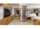 Well-equipped kitchen featuring stainless steel appliances, wooden cabinets, and ample counter space at 2360 Kings Grant Rd, Lincolnton, NC 28092