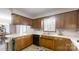 Charming kitchen features wood cabinets, tiled floors, and modern appliances for a functional and inviting space at 2360 Kings Grant Rd, Lincolnton, NC 28092