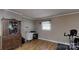Home office features a vintage cabinet, desk, and exercise bike, perfect for working and staying active at 2360 Kings Grant Rd, Lincolnton, NC 28092