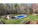 Backyard view of in-ground pool, shed, and covered patio area at 2360 Kings Grant Rd, Lincolnton, NC 28092
