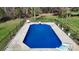 A fenced in in-ground pool with lounge chairs and ample patio space at 2360 Kings Grant Rd, Lincolnton, NC 28092