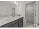 Bright bathroom showcasing double sinks, gray vanity, white countertops, and bathtub at 281 Supernova Dr, York, SC 29745