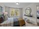 Bright bedroom with a large window, a cozy bed with warm blankets and a decorative mirror at 281 Supernova Dr, York, SC 29745