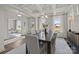 Elegant dining room with large windows, chandelier, table with seating for six at 281 Supernova Dr, York, SC 29745