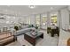 Open-concept living room with ample natural light, comfortable seating, and views into the kitchen at 281 Supernova Dr, York, SC 29745
