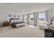 Spacious main bedroom with large windows, plush carpeting, and a sitting area at 281 Supernova Dr, York, SC 29745