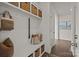 Mudroom featuring bench with storage, hooks and shelving at 281 Supernova Dr, York, SC 29745