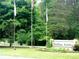 Charming entrance sign to Carolina Forest, surrounded by mature trees and manicured landscaping at 339 Pine Lake Dr # 760, Troy, NC 27371