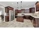 Spacious kitchen with stainless steel appliances, central island, and dark wood cabinets at 404 Brannon Meadows Dr # 270, York, SC 29745