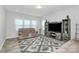 Cozy living room with a comfortable sofa, a large TV, and lots of natural light at 404 Brannon Meadows Dr # 270, York, SC 29745