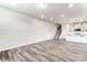 Open concept living room view of the staircase and kitchen at 4102 Cheyney Park Dr, Charlotte, NC 28269