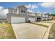 Exterior elevation of townhomes with garages and decks at 4118 Cheyney Park Dr, Charlotte, NC 28269
