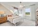 Bright bedroom with natural light, a metal bed frame, side table, and soft window treatments at 4790 Formation Ct # 67, Lancaster, SC 29720
