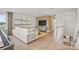 Open-concept living room featuring hardwood floors, a plush sofa, and modern media center at 4790 Formation Ct # 67, Lancaster, SC 29720