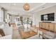 Bright open-concept living room featuring modern decor, hardwood floors, and seamless flow to the kitchen at 4790 Formation Ct # 67, Lancaster, SC 29720