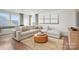 Cozy living room with a plush sectional sofa, accent rug, and ample natural light from large windows at 4790 Formation Ct # 67, Lancaster, SC 29720