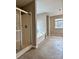 A bathroom featuring a glass shower and a tub at 4809 Canipe Dr, Charlotte, NC 28269