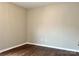Bedroom features neutral paint, hardwood floors, base molding, and ample natural light at 4809 Canipe Dr, Charlotte, NC 28269