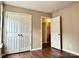 Bedroom with closet, hardwood floors, base molding, and ample natural light at 4809 Canipe Dr, Charlotte, NC 28269