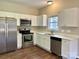 Modern kitchen with stainless steel appliances, white cabinets, and ample counter space at 4809 Canipe Dr, Charlotte, NC 28269