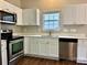 Modern kitchen featuring stainless steel appliances and white cabinets at 4809 Canipe Dr, Charlotte, NC 28269