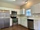 Modern kitchen featuring stainless steel appliances and white cabinets at 4809 Canipe Dr, Charlotte, NC 28269