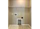 A spacious laundry room includes washer and dryer hookups, and shelving for storage at 4809 Canipe Dr, Charlotte, NC 28269