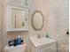 Vintage bathroom featuring wallpaper and a medicine cabinet at 517 Stockton St, Statesville, NC 28677
