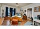Bedroom featuring hardwood floors, natural light, and access to ensuite at 517 Stockton St, Statesville, NC 28677