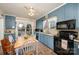 Traditional kitchen showcasing a brick floor, vintage cabinetry, and a stainless steel range at 517 Stockton St, Statesville, NC 28677