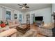 Comfortable living room with a fireplace, plush sofas, and a view into other rooms at 517 Stockton St, Statesville, NC 28677