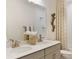 Bright bathroom features double vanity, large mirror and a tiled shower over tub at 5911 Wetlands Aly, Charlotte, NC 28215