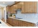 Modern kitchen featuring stainless steel appliances, ample cabinet space, and sleek countertops at 5911 Wetlands Aly, Charlotte, NC 28215