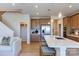 Well-lit kitchen featuring stainless appliances, a central island, and seamless flow into the living area at 5911 Wetlands Aly, Charlotte, NC 28215