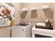 Bright laundry room features a washer, dryer, shelving, and modern decor at 5911 Wetlands Aly, Charlotte, NC 28215