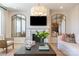 Inviting living room with fireplace, stylish decor, comfortable seating, and large mirrors at 5911 Wetlands Aly, Charlotte, NC 28215