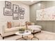 Stylish living room featuring modern art, comfortable seating, and a contemporary aesthetic at 5911 Wetlands Aly, Charlotte, NC 28215