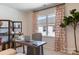 Modern home office with shelving, large window, and a stylish desk at 5911 Wetlands Aly, Charlotte, NC 28215