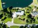 Aerial view of an estate on waterfront showcasing the manicured gardens and estate layout at 6823 Manatee Dr, Concord, NC 28025