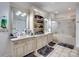 Bathroom featuring a double vanity, linen closet, and a glass-enclosed shower at 6823 Manatee Dr, Concord, NC 28025
