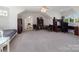 Spacious bonus room featuring a bed, study space, ceiling fan and lots of natural light at 6823 Manatee Dr, Concord, NC 28025