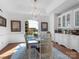 Bright dining room featuring hardwood floors, a chandelier, and a lake view at 6823 Manatee Dr, Concord, NC 28025