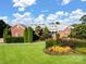 Charming brick home with a well-manicured lawn and colorful landscaping, creating a welcoming curb appeal at 6823 Manatee Dr, Concord, NC 28025