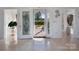 Elegant foyer with tile floors, decorative glass door, and bright, airy atmosphere, welcomes you into the home at 6823 Manatee Dr, Concord, NC 28025