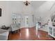 Inviting foyer with hardwood floors, a staircase, and natural light streaming through the front door at 6823 Manatee Dr, Concord, NC 28025